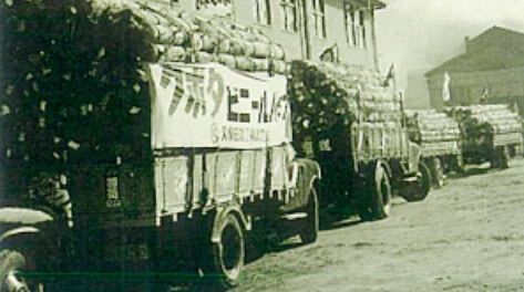 The first shipment on trucks lined up in front of the vinyl pipe plant’s office