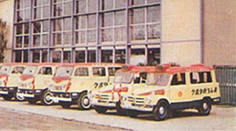 Service vehicles lined up in front of the headquarters building