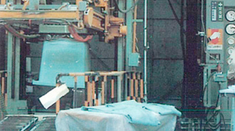 An FRP bathtub being formed in a 1,500 ton hydraulic press